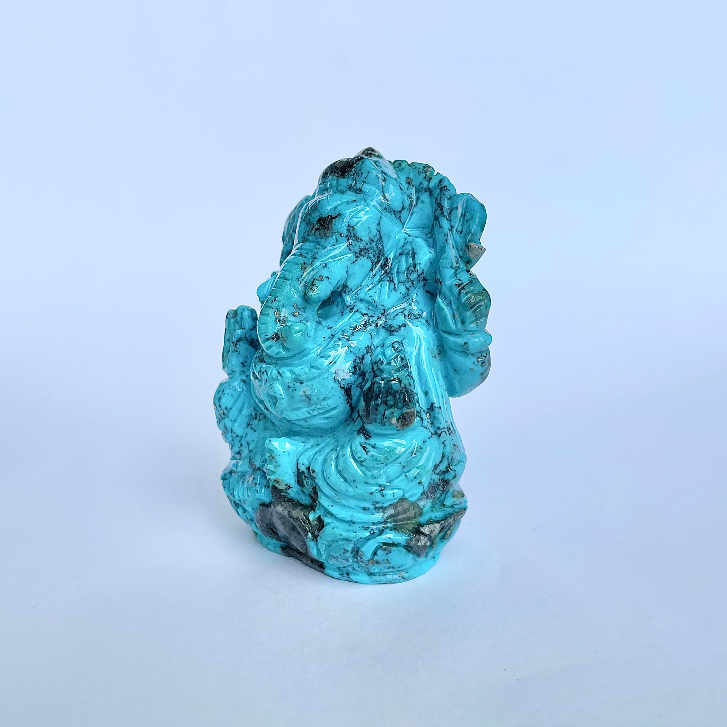 พระพิฆเนศองค์ใหญ่ สีฟ้าเทอร์ควอยซ์ น้ำหนัก 1,025 กะรัต สูง 7.8 ซม.(TRQ-MRT-1.)