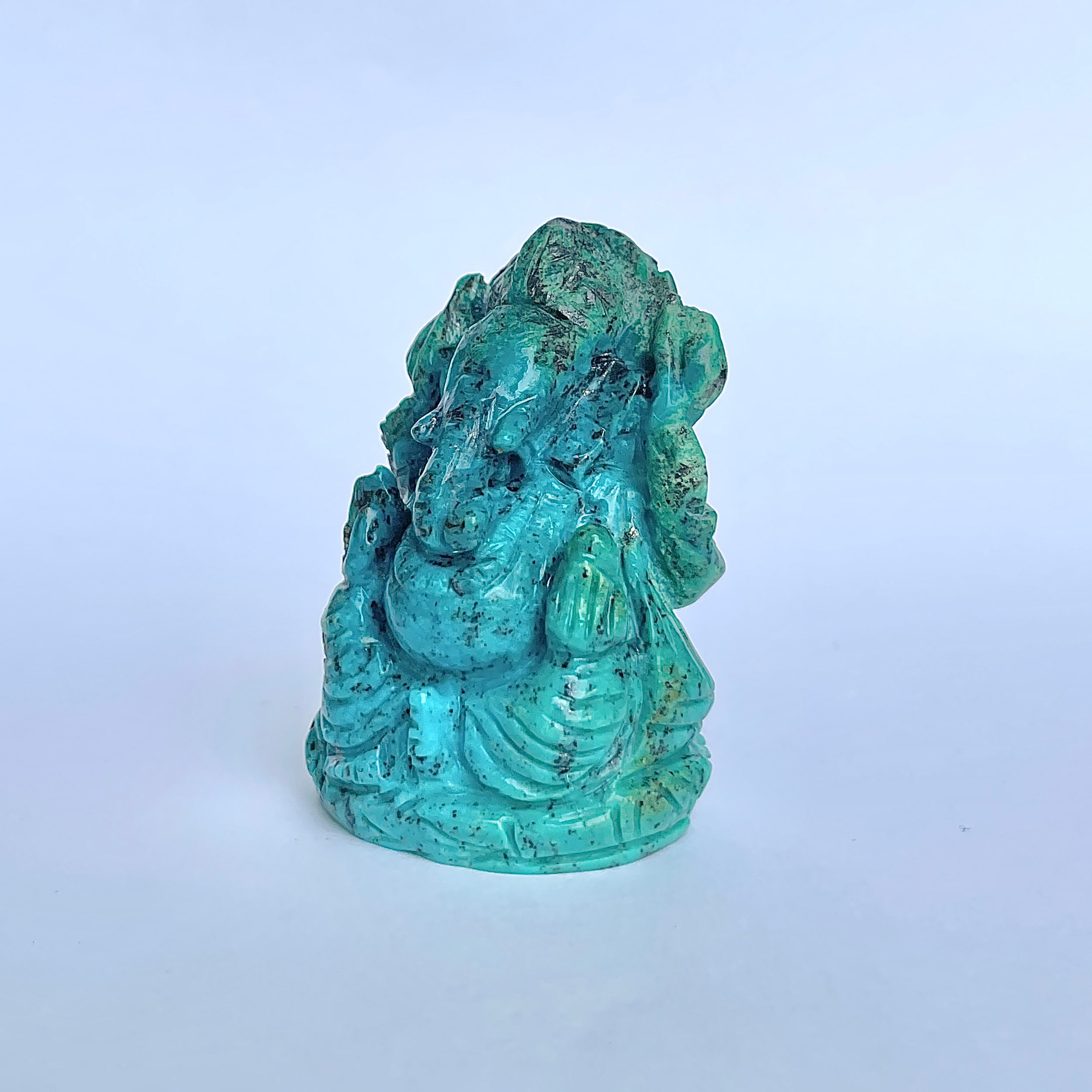 พระพิฆเนศองค์ใหญ่ สีฟ้าเทอร์ควอยซ์ น้ำหนัก 475 กะรัต สูง 5.5 ซม.(TRQ-MRT-10.)