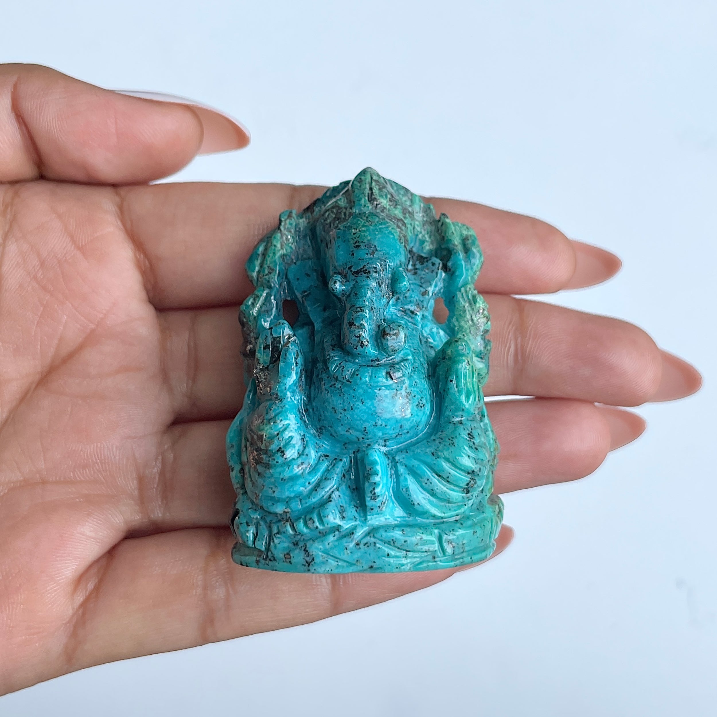 พระพิฆเนศองค์ใหญ่ สีฟ้าเทอร์ควอยซ์ น้ำหนัก 475 กะรัต สูง 5.5 ซม.(TRQ-MRT-10.)