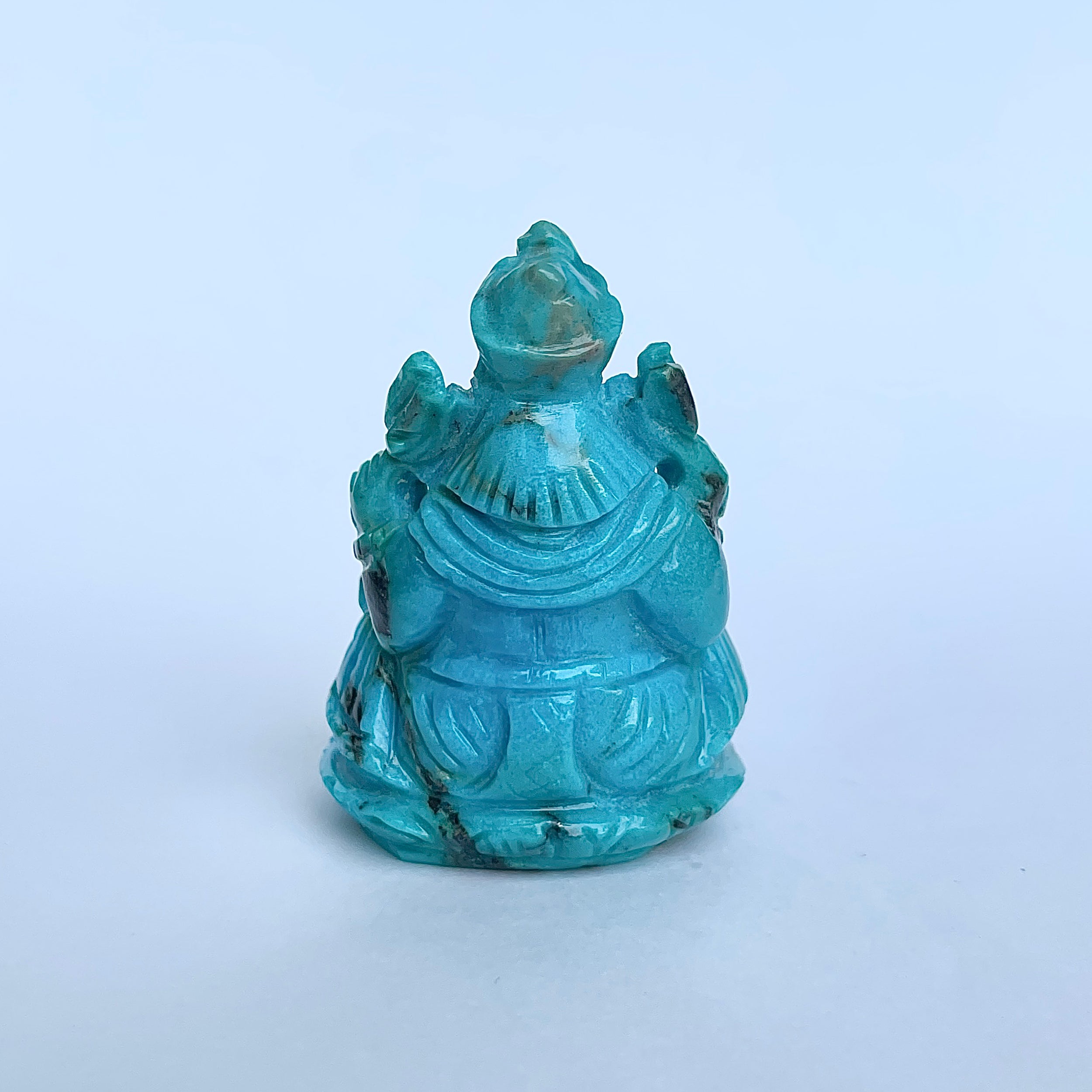 พระพิฆเนศทรงเครื่องสีฟ้าเทอร์ควอยซ์ น้ำหนัก 350 กะรัต ส่วนสูง 5.1 ซม.(TRQ-MRT-5.)