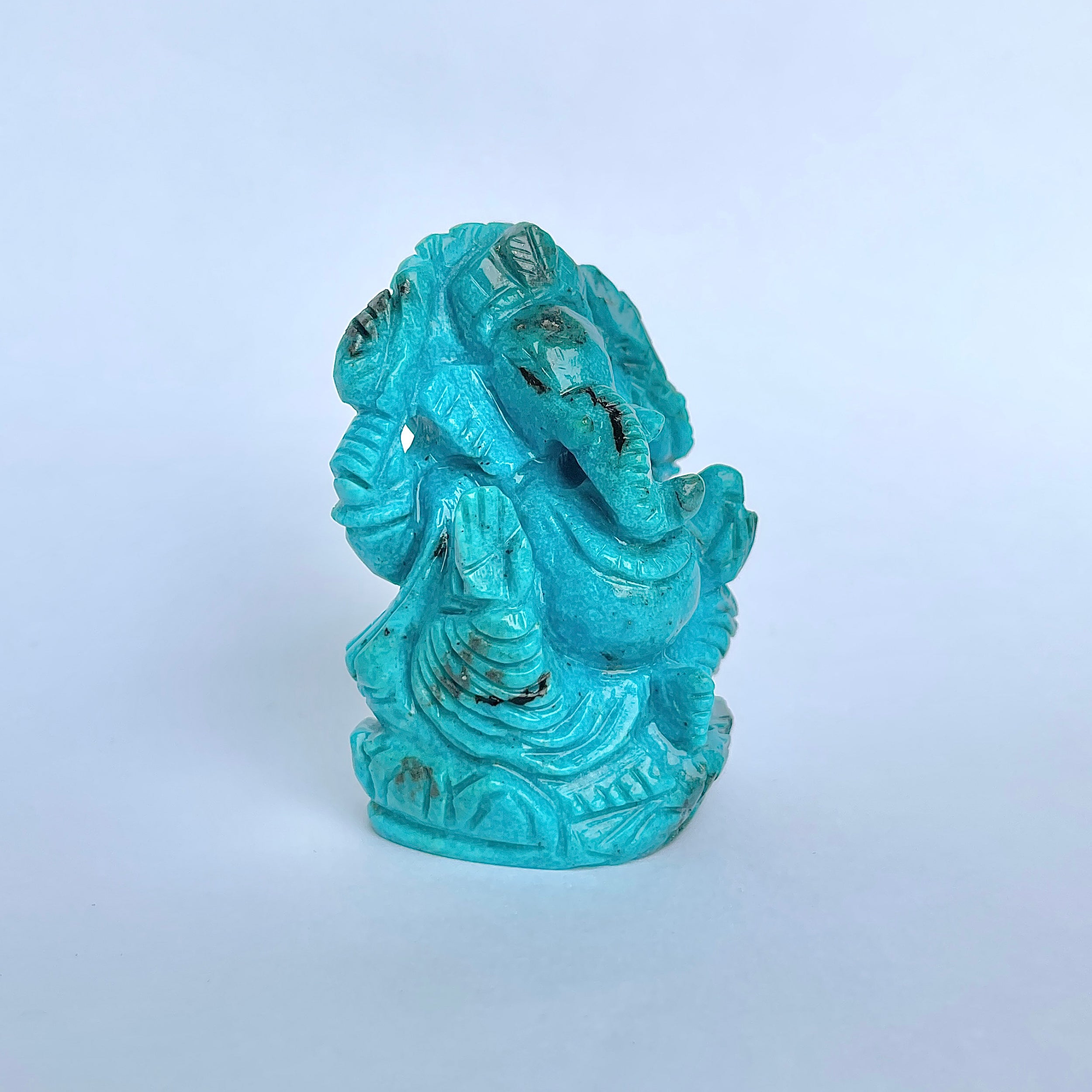 พระพิฆเนศองค์ใหญ่ สีฟ้าเทอร์ควอยซ์ น้ำหนัก 470 กะรัต สูง 6.2 ซม.(TRQ-MRT-9.)